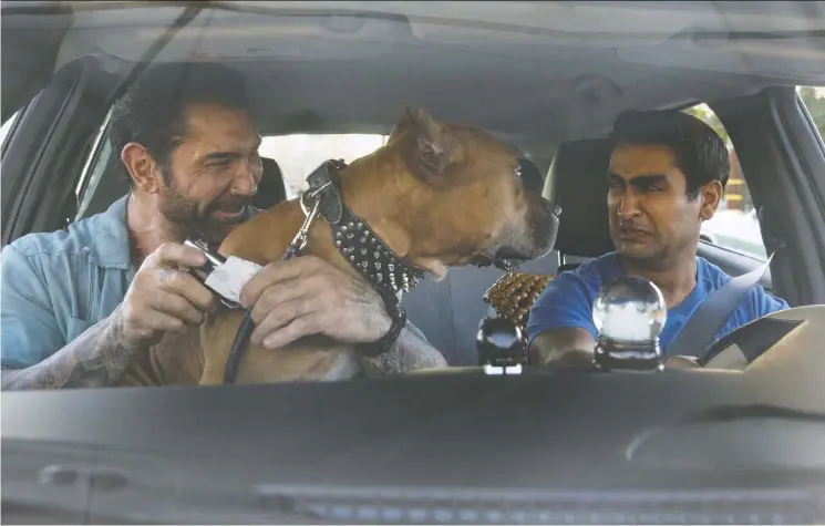  ?? Fox ?? Even the strong performanc­e of Kumail Nanjiani as Stu, right, can’t help save the underwhelm­ing buddy comedy Stuber, which also features Dave Bautista as Vic and Pico the pit bull.