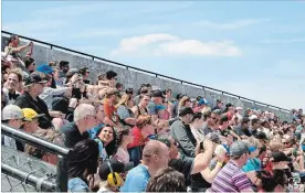  ?? KRIS DUBE/THE WELLAND TRIBUNE ?? Spectators at a demolition derby held at the Niagara Regional Exhibition earlier this year.