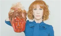  ??  ?? CNN fired comedian Kathy Griffin for posing with a fake decapitate­d head of Donald Trump. But coffee mugs and T-shirts bearing a similar image of Hillary Clinton sparked little outrage.