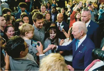  ?? PATRICK SEMANSKY/AP ?? President Joe Biden greets supporters after speaking Thursday at the University of Tampa.