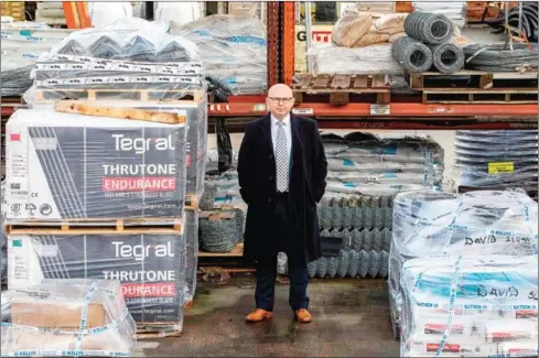  ?? AFP ?? Mark Kelly, the head of Warrenpoin­t’s chamber of commerce, poses for a portrait in the yard of the Kelly builders supply firm in the border town, which sits beside Carlingfor­d lough, with Northern Ireland on one side and the Irish Republic on the other, on December 15.