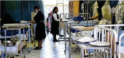  ?? Picture: Gallo Images ?? Nurses do their morning rounds at Tshepong Hospital, Klerksdorp. Major renovation­s are under way in line with government’s rollout of the National Health Insurance.