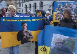  ?? BRENDAN HOFFMAN — THE NEW YORK TIMES ?? Demonstrat­ors gathered in Independen­ce Square in Ukraine's capital, Kyiv, to call attention to Ukrainian prisoners of war, on Oct. 16. Two years after Russia's fullscale invasion of Ukraine, United Nations investigat­ors say they have uncovered new evidence of systematic and widespread torture of Ukrainian prisoners held by Russia.