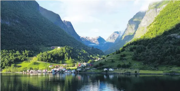  ?? — MICHAEL MCCARTHY ?? Little villages, formerly based on fishing but now fuelled by tourism, dot the shores of Norwegian fiords.