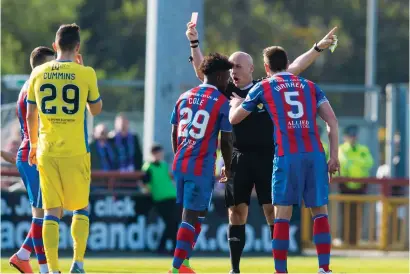  ??  ?? Stephen Finnie shows Larnell Cole the red card after the Inverness midfielder’s impetuous reaction