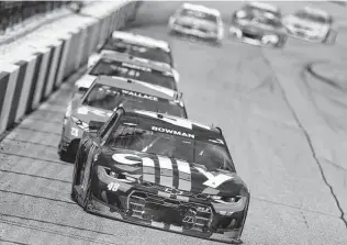  ?? Brian Lawdermilk / Getty Images ?? Alex Bowman, front, passed Denny Hamlin on a restart with just 10 laps left for the win. It was Bowman’s third career victory, and he is the eighth driver to claim a Cup Series race this season.