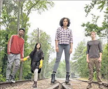  ?? Daniel McFadden 20th Century Fox ?? SKYLAN BROOKS, left, Miya Cech, Amandla Stenberg and Harris Dickinson in Jennifer Yuh Nelson’s film.