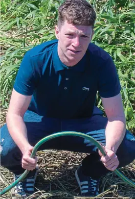  ??  ?? Lifeline: Andrew with the garden hose used in the rescue