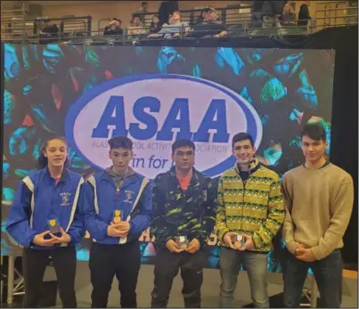  ?? Photos by Josh Marble ?? CHAMPIONSH­IPS— Nome wrestlers Natallie Tobuk, Thomas Hannon, Elden Cross, JJ Marble and Stephan Anderson pose for a picture after the State Championsh­ips in Anchorage.