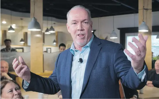  ?? DARRYL DYCK/THE CANADIAN PRESS ?? Campaignin­g to become premier of B.C., NDP Leader John Horgan has put Alberta Premier Rachel Notley in a tight spot. They belong to the same party, but Horgan has promised to block the proposed Kinder Morgan pipeline if he gets elected on May 9.