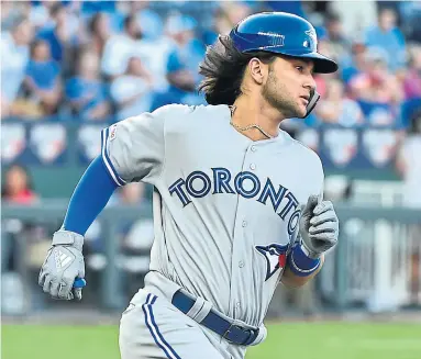  ?? ED ZURGA GETTY IMAGES ?? Blue Jay Bo Bichette hit the ground running in his major-league debut in Kansas City, reaching on a single in his first at-bat at Kauffman Stadium on Monday night. He finished the night 1-for-4.