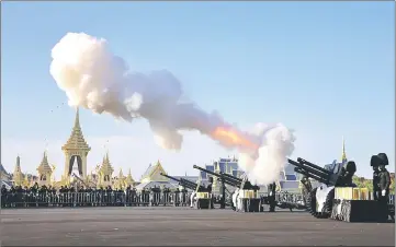  ??  ?? Thai royal guards salute during a funeral rehearsal for late King Bhumibol near the Grand Palace in Bangkok, Thailand. — AFP photo