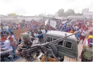  ?? FARAH ABDI WARSAMEH/ASSOCIATED PRESS ?? A Somali soldier sits with a machine gun on top a truck near the scene of Saturday’s attack in Somalia