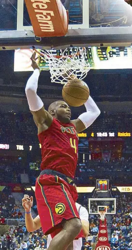  ?? AP ?? Atlanta Hawks’ Paul Millsap slams one in during their NBA clash with the New York Knicks.