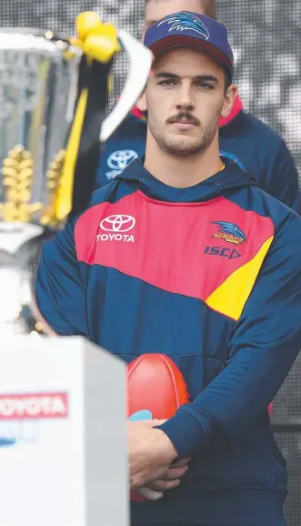  ??  ?? DETERMINED: Crows captain Taylor Walker eyes the big prize at yesterday’s grand final parade.