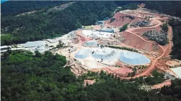  ??  ?? Work goes on: Aerial view of the illegal granite quarry in Teluk Bahang.