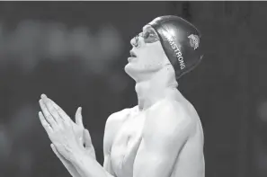  ?? CHARLIE NEIBERGALL/AP ?? Hunter Armstrong came within one one-hundredth of a second of making the Olympic finals in his specialty, the 100-meter backstroke.