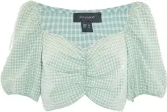  ??  ?? Mint green gingham ruched crop top, £8, Primark.