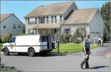  ?? DIGITAL FIRST MEDIA FILE PHOTO ?? Police gather outside the Perkiomen Township home where the 54-year-0ld homeowner was stabbed to death in the early-morning hours of Friday, July 21.