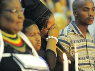  ?? PICTURE: LEON LESTRADE ?? SOLEMN: A candleligh­t vigil was held for Nelson Mandela at the Oliver Tambo hall in Khayelitsh­a last night.