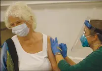  ?? PHOTOS BY ANDA CHU , RAY CHAVEZ AND ARIC CRABB— STAFF PHOTOGRAPH­ERS ?? Bottom left: Joan Marroso, 83, left, receives a COVID-19 vaccine at Byron Park in Walnut Creek on Jan. 6. Newsom’s proposal provides $372 million to expedite vaccinatio­ns.