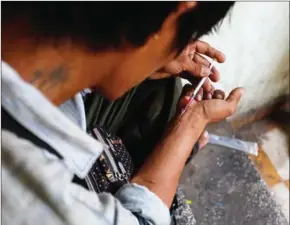  ?? HENG CHIVOAN ?? A man injects drugs in Phnom Penh. Despite Cambodia’s anti-drug campaign, the flow of illegal substances into the Kingdom from abroad does not appear to have slowed.