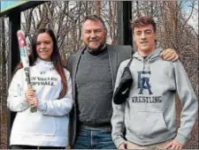  ?? SUBMITTED PHOTO — COURTESY OF AMANDA C. LEE ?? Aston Sports Hall of Fame president Kevin Talbot, center, stands with Sun Valley softball player Madison Gutowiecz and Episcopal Academy wrestler Blair Orr, who will receive the 2018 William “Butch” Ryan Memorial Scholar-Athlete awards.