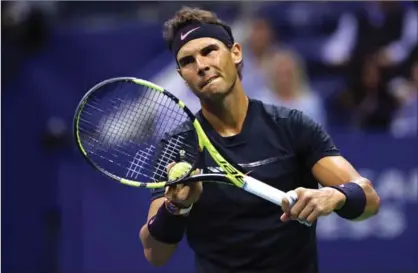  ?? ELSA, GETTY IMAGES ?? Rafael Nadal serves against Juan Martin del Potro during their men’s singles semifinal match at the U.S. Open tennis tournament Friday night. Nadal won the match, 4-6, 6-0, 6-3, 6-2, and will meet South Africa’s Kevin Anderson in the final Sunday.