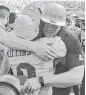  ?? Julio Aguilar / Getty Images ?? Central Florida coach Scott Frost embraces running back Adrian Killins Jr. after winning the American Athletic Conference title Saturday.