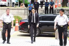  ?? — AFP photo ?? T.O.P (Centre) arrives at a court to attend his trial on charges of smoking marijuana in Seoul last month.