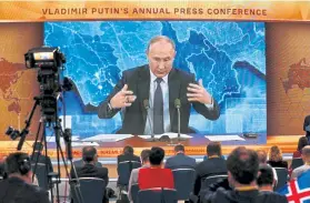  ?? Alexander Zemlianich­enko, The Associated Press ?? Vladimir Putin speaks during a video news conference Thursday in Moscow. The Russian president rejected allegation­s that the Kremlin was behind the poisoning of his top political foe, opposition leader Alexei Navalny.