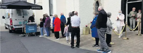  ??  ?? Parishione­rs who returned to Mass at St Patrick’s Church, Strandhill, on Sunday received a treat afterwards – a free ice cream from Mammy Johnston’s.
