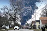  ?? The Associated Press ?? ■ A black plume rises over East Palestine, Ohio, as a result of a controlled detonation of a portion of the derailed Norfolk Southern train on Feb. 6.