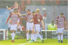  ??  ?? Joy Accies players celebrate their late winner