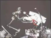  ?? Guo Zhongzheng Xinhua News Agency ?? Chinese astronaut Cai Xuzhe conducts a spacewalk Saturday around the space station lab module Wentian.