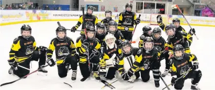  ??  ?? Widnes Wild under 11 team line up and (right) in action