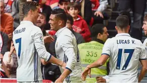  ??  ?? You surprised us: Real Madrid’s Cristiano Ronaldo (left) congratula­ting Carlos Casemiro after he scored the winner in the 2-1 win over Athletic Bilbao. — Reuters