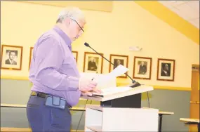  ?? Leslie Hutchison / Hearst Connecticu­t Media ?? Ray Drew, administra­tor for the Water Pollution Control Authority, talks about the assessment charges for the proposed sanitary sewer installati­on.