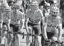  ?? [PETER DEJONG/THE ASSOCIATED PRESS] ?? Britain’s Chris Froome, center, leads the Tour de France by 23 seconds after Thursday’s ride through the Alps.