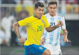  ?? FOTO: AP ?? Firmino en el último partido de Brasil ante Argentina con Dybala