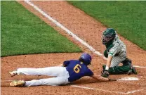  ?? DAVID JABLONSKI / STAFF ?? Badin catcher Jimmy Nugent, one of the 2022 Johnny Bench Award winners, tags out Bloom-Carroll’s Evan Dozer in a Division II state semifinal earlier this month in Akron.