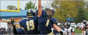  ??  ?? Spring-Ford’s Colby Goldsmith (19) and Justin DeFrancesc­o (1) celebrate after Goldsmith’s 2-yard touchdown reception in the fourth quarter. (Sam Stewart - Digital First Media)