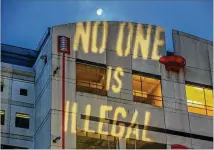  ?? PHOTOS BY JOHN SPINK / JSPINK@AJC.COM ?? An anti-ICE message is projected across the top of the Atlanta City Jail. Last week, Atlanta Mayor Keisha Lance Bottoms signed an order stopping Immigratio­n Customs Enforcemen­t (ICE) from sending any new detainees to the jail.