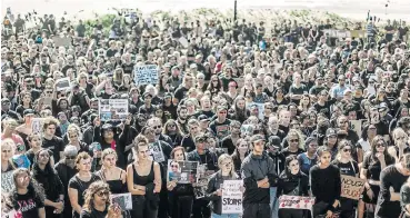  ?? /AFP ?? In solidarity: Protesters take part in a march against gender-based violence at North Beach in Durban on September 7. A march to the Cape Town Internatio­nal Convention Centre days earlier forced President Cyril Ramaphosa to interrupt World Economic Forum meetings to address the protesters.