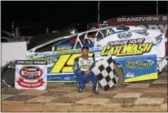  ?? RICH KEPNER - FOR DIGITAL FIRST MEDIA ?? Jared Umbenhauer celebrates in victory lane after his Modified win at Grandview Speedway on Aug. 25.