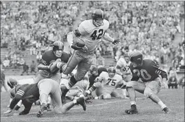  ?? Associated Press ?? C.R. ROBERTS, shown in a game against California in 1955, set a USC record a year later when he rushed for 251 yards against Texas at Austin.