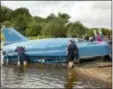  ?? DAVID CHESKIN/PA VIA AP ?? The restored Bluebird K7, which crashed killing pilot Donald Campbell in 1967, takes to the water for the first time in more than 50 years off the Isle of Bute on the west coast of Scotland, Saturday, Aug. 4.