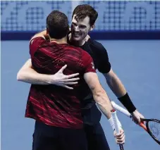  ??  ?? On track Jamie Murray and Bruno Soares embrace after their important win