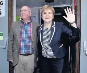  ??  ?? > Nicola Sturgeon, Scotland’s First Minister, votes at Ballieston Community Hall