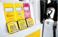  ?? ASSOCIATED PRESS FILE PHOTO ?? Prices for the three grades of gasoline light up the pump at a Shell station in southeast Denver in May. On Tuesday the Labor Department reported gasoline prices were one of the largest factors in the rise of consumer prices for May.